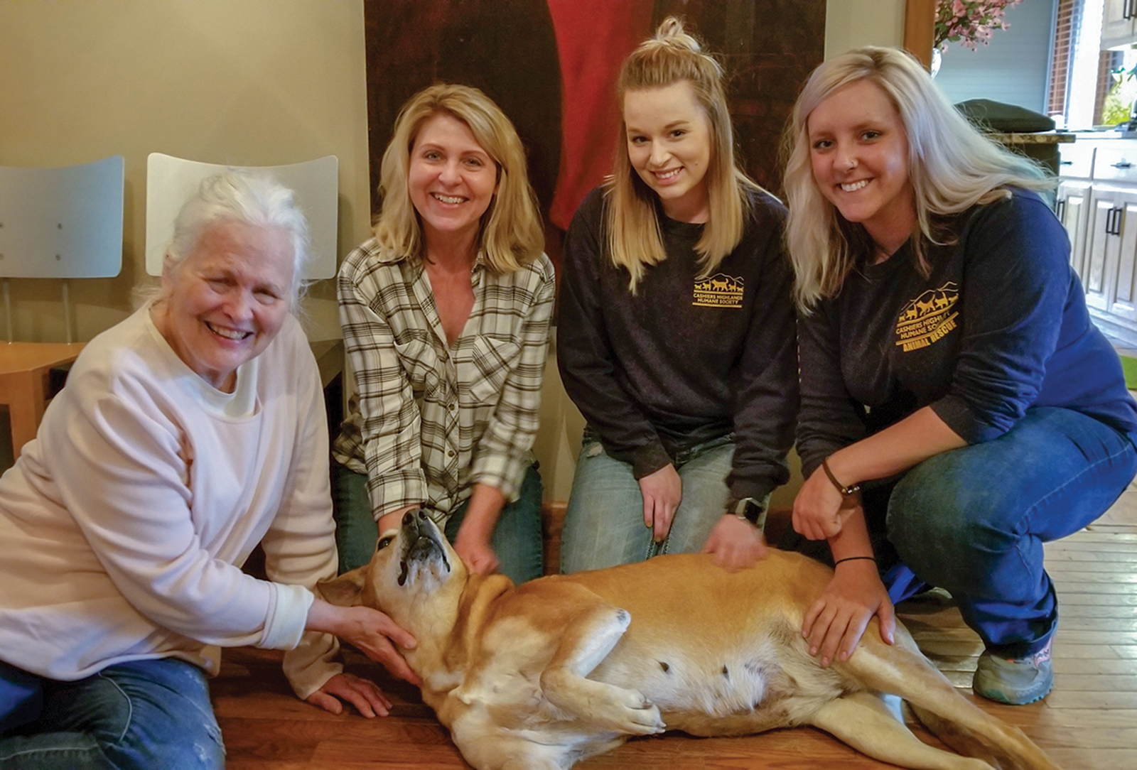 (Left to Right) Eileen Anderson, Heidi Leland,  CHHS Assistant Manager Jodi Henkel,  CHHS Shelter Manager Kaitlyn Moss, (foreground) Caramel